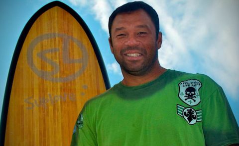 Sunny Garcia, a legend in the surfing world, poses in front of a Suplove stand up paddle board. Photo Coutersy: Suplove