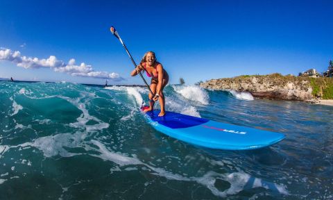 World Champion and Starboard SUP athlete Izzi Gomez knows how to have fun in the water. | Photo: Starboard / Georgia Schofield