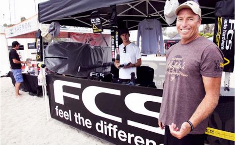 Tyler Callaway, the face of FCS in the US, stands by the FCS booth at the Battle of the Paddle in Dana Point. Photo: Sup Connect.