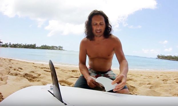 Todd Caranto demonstrates how to install side bite fins into a paddle board. 
