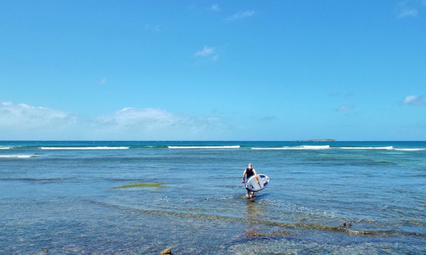 Tez Plavenieks headed out for a paddle in Grenada. | Photo: Fi Plavenieks