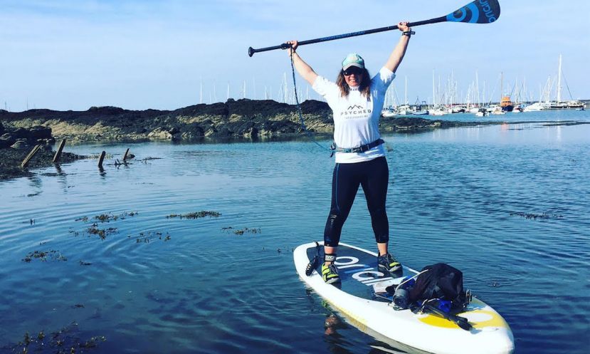 A visibly stoked Sian Sykes after finishing her circumnavigation of Anglesey. | Photo via: Sian Sykes