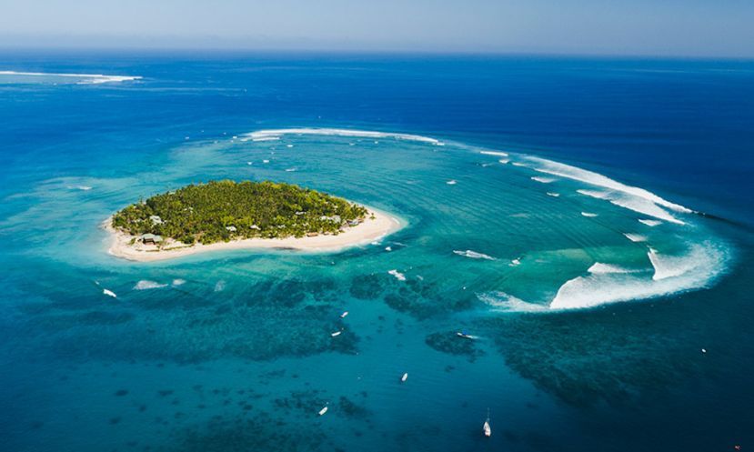 Tavarua Island will be rounded by the athletes during the distance race and Cloudbreak, seen in the background, will host the SUP surfing and Technical Races. | Photo: Tourism Fiji