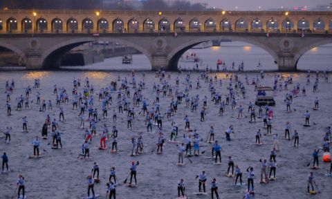 Early morning start at the 6th Annual Nautic SUP Crossing in Paris. | Photo via: Nautic SUP Crossing.com