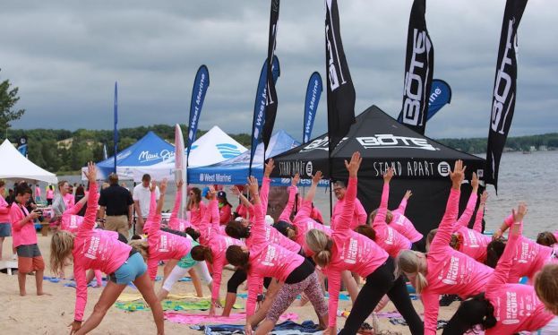 Participants take part in a yoga exercise at Standup for the Cure's 2016 Muskegon event.