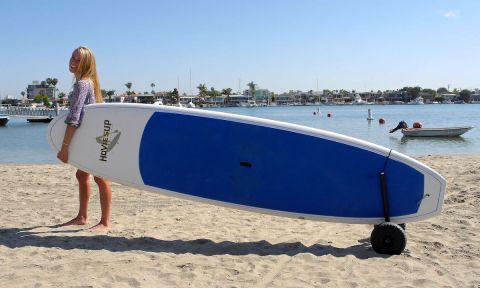 CorSurf's paddle board cart makes it easy to carry your heavy board! | Photo: Andy Gossett