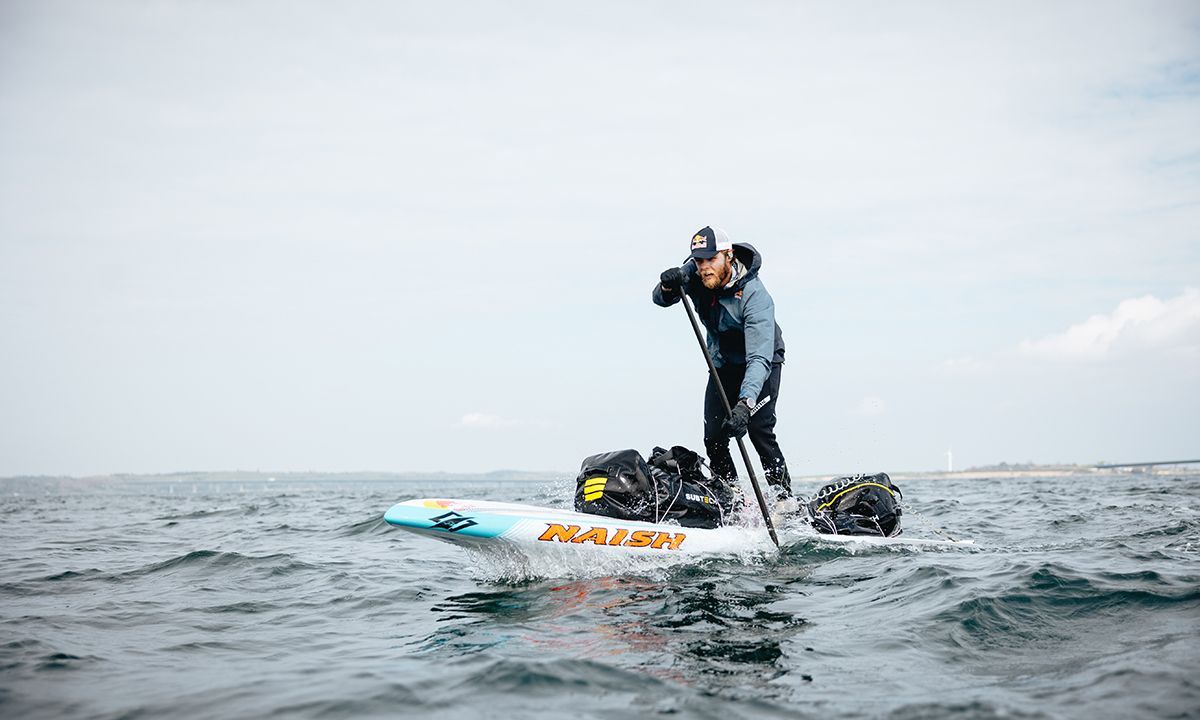 Casper Steinfath on his way to becoming the first-ever to circumnavigate Denmark on a SUP. | Red Bull Medie House / Kasper Bøttern