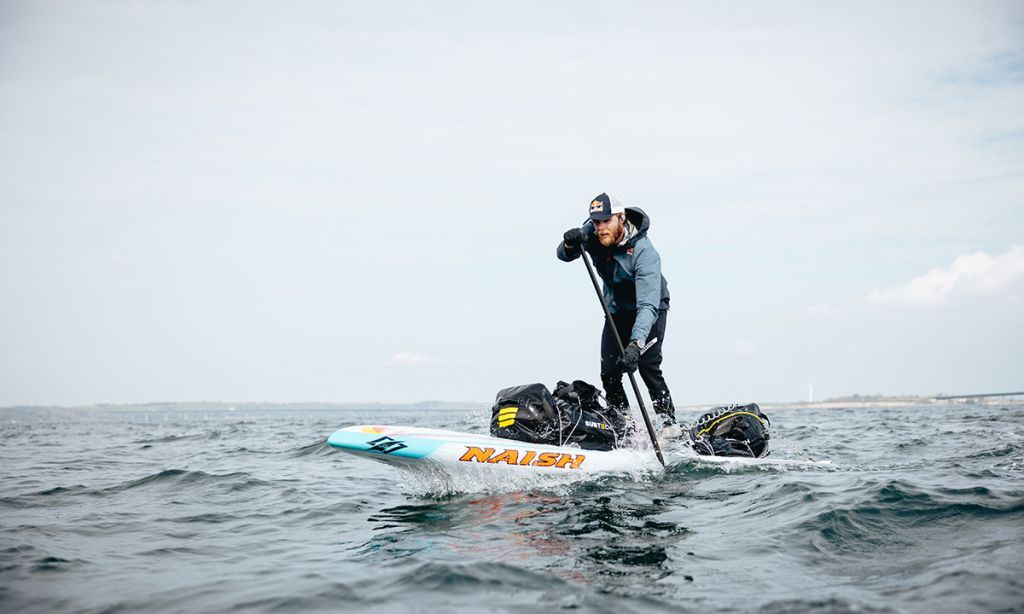 Casper Steinfath on his way to becoming the first-ever to circumnavigate Denmark on a SUP. | Red Bull Medie House / Kasper Bøttern