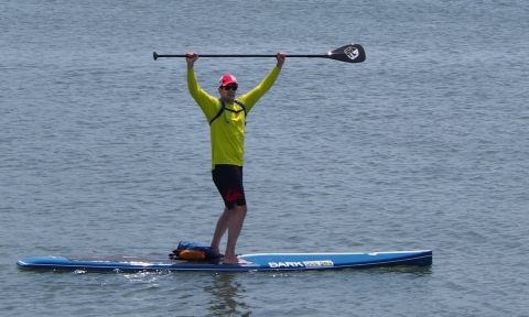 Jon Baker of Egg Harbor Township celebrates after completing the 22.5-mile race around Absecon Island at the Dean Randazzo Cancer Foundation Paddle For A Cause in 2015. | Photo courtesy: Dean Randazzo Cancer Foundation