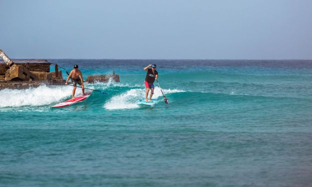 Connor Bonham and Matt Hite share a wave in Barbados. | Photo Courtesy: BIC SUP