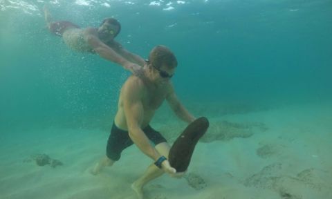 Chuck Glynn underwater strength training...with a little assistance. | Photo via: The Ultimate Waterman