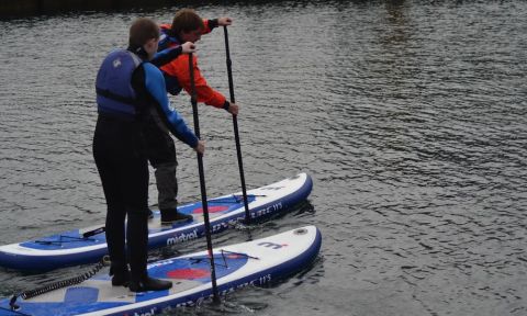 Dan, enjoys teaching stand up paddling to differently abled children.