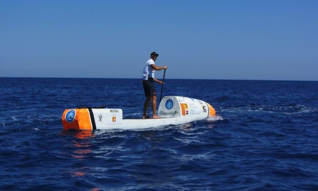 Nicolas Jarossay tests out his custom SUP made for his Transatlantic excursion.