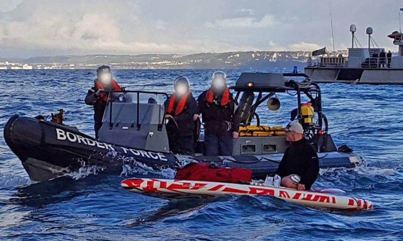 The German paddle boarder meeting with the border force. | Photo: Thomas Packman / Emma Barlow