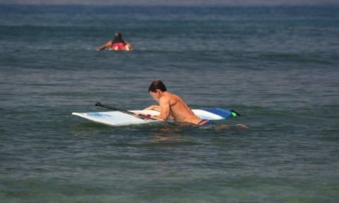 Sean Poynter gives us a few helpful tips on how to get back to standing on our SUP after falling. | Photo: Matty &amp; Elena Schweitzer