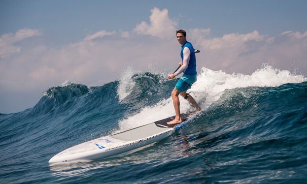 Kody Kerbox SUP surfing off the coast of Maui, Hawaii.