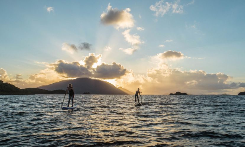 Nikki Gregg and friend paddling in New Caledonia during filming for a Facing Waves episode. | Photo Courtesy: Facing Waves