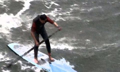 Matt Becker facing the challenging conditions in Santa Cruz, California at the Surftech Surf &amp; Sand Duel-athlon.