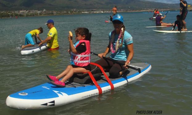 Andrea Moller sharing her love of the ocean with a Maui grom at the 2015 Imua Keiki O Ke Kai 2015 event. | Photo: Erik Aeder